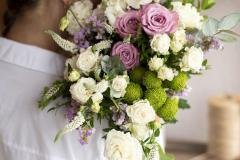 close-up-woman-holding-flowers-bouquet