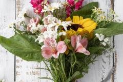 top-view-female-hand-preparing-bouquet-flowers